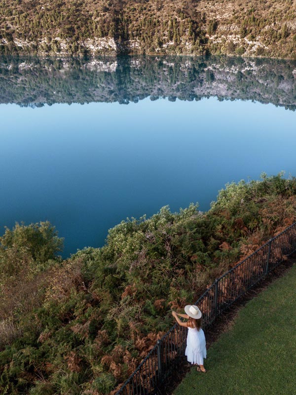 a woman sightseeing at the Little Blue Lake, Mt Gambier