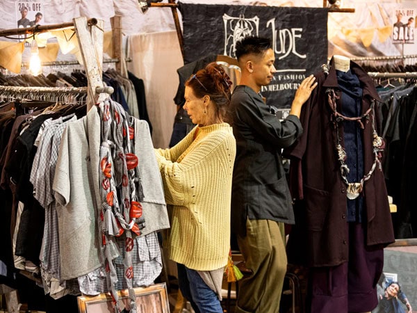 people browsing through clothes on display at Bowerbird