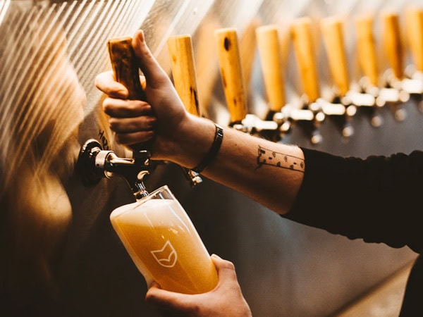 pouring tap beer into a glass at Fox Friday