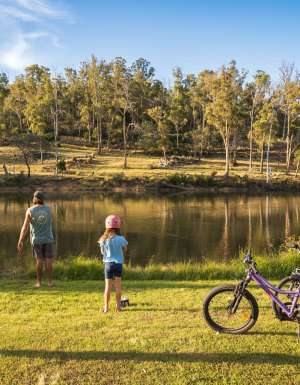 a father and daughter with their bicycles at Hadspen River