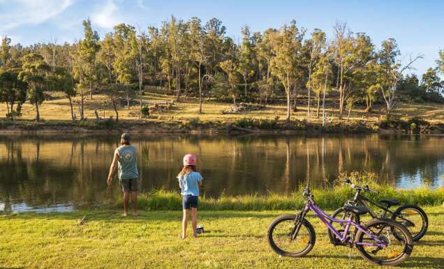 a father and daughter with their bicycles at Hadspen River