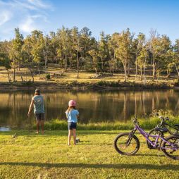 a father and daughter with their bicycles at Hadspen River