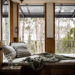 a bed with scenic bush views at The Voyager, Huon Valley