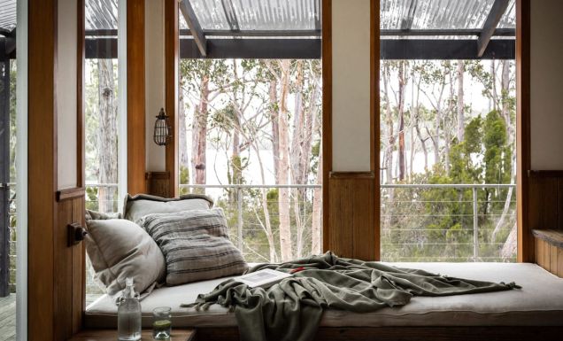 a bed with scenic bush views at The Voyager, Huon Valley