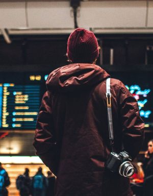 Person looking at flight schedule in airport