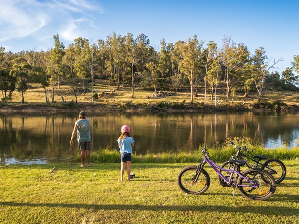 a father and daughter with their bicycles at Hadspen River
