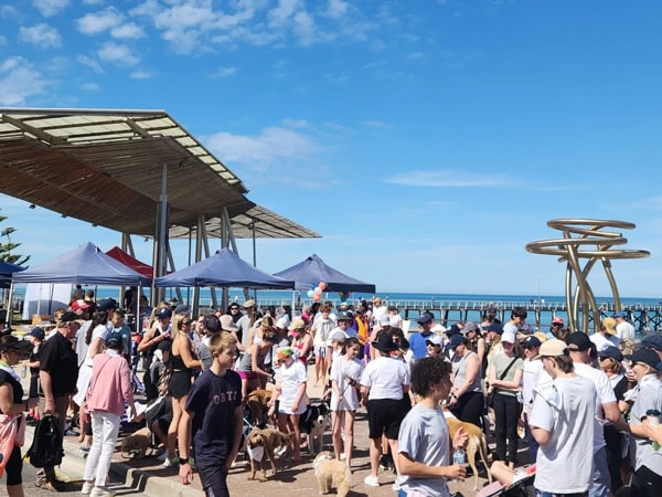 crowded beachfront shopping stalls at Henley Square Markets