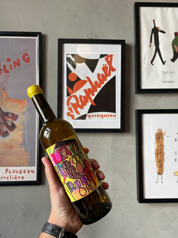 hand holding a bottle of Lucinda Wine, Hobart