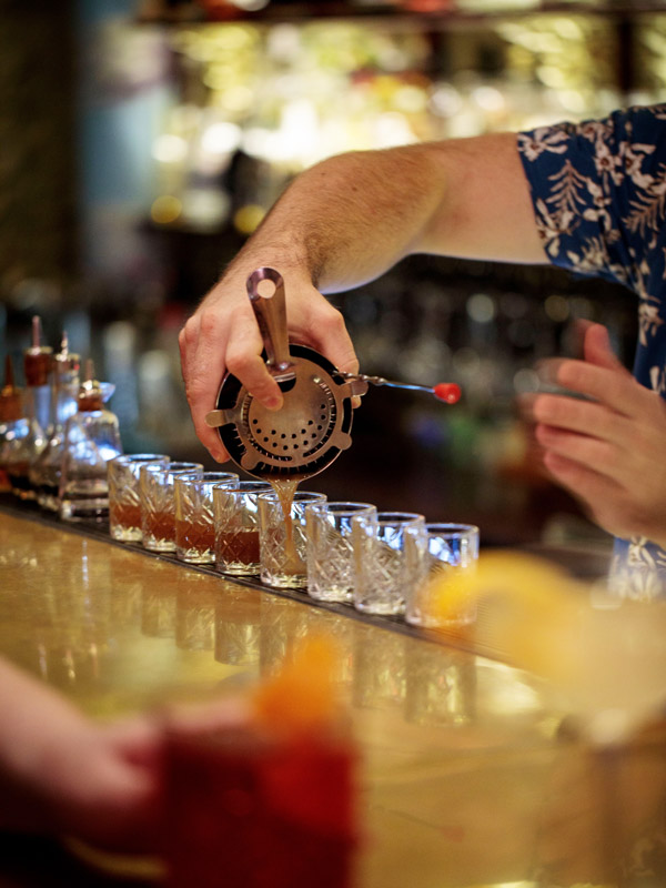 pouring spirits into glass at Gold Bar, Hobart