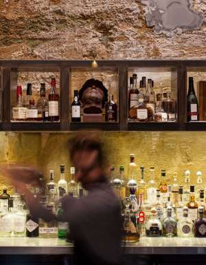 a blurry image of a bartender at Void Bar, Hobart