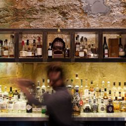 a blurry image of a bartender at Void Bar, Hobart