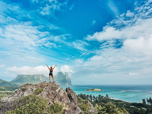 a woman standing on top of Lord Howe Island