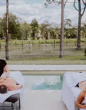 two people undergoing massage treatments by the pool at Nu Leaf Retreat, Hunter Valley