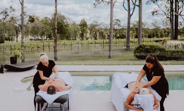 two people undergoing massage treatments by the pool at Nu Leaf Retreat, Hunter Valley