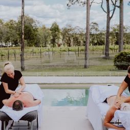two people undergoing massage treatments by the pool at Nu Leaf Retreat, Hunter Valley