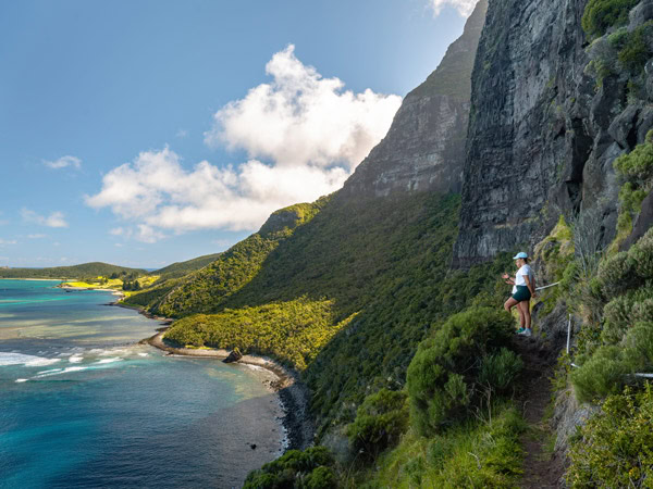 a hiker traversing the Seven Peaks Walk