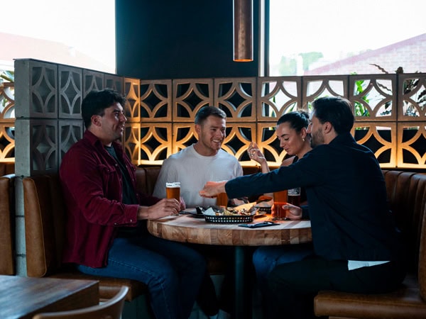 friends drinking and dining at Shambles Brewery, Hobart