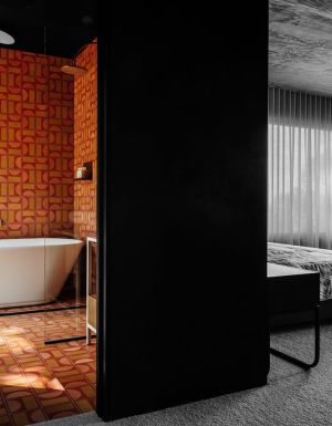 Interior view of the bedroom and bathroom at Slow Beam in Hobart
