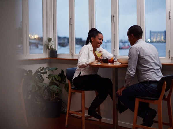 a couple dining at Stillwater with views of the Tamar River