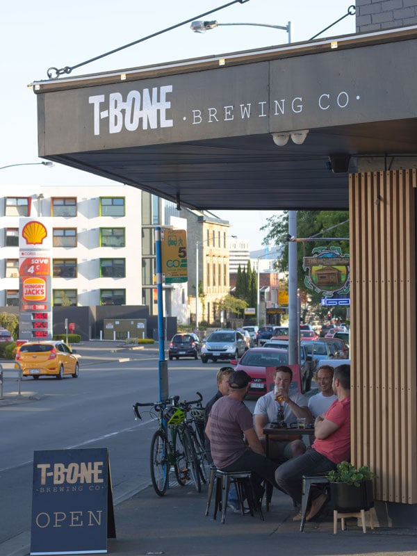 friends drinking outside T-Bone Brewing Co.