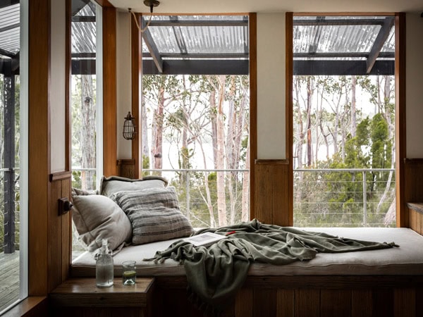 a bedroom with scenic bush views at The Voyager, Huon Valley