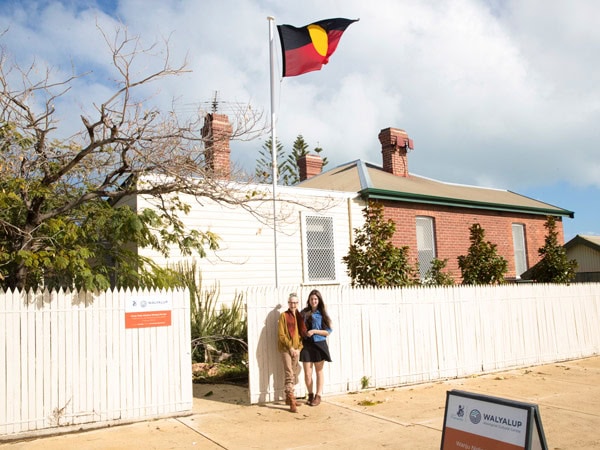two people posing for a picture in front of Walyalup Aboriginal Cultural Centre