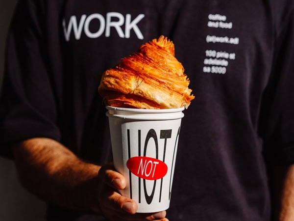 a hand holding a hot pastry at WORK, Adelaide