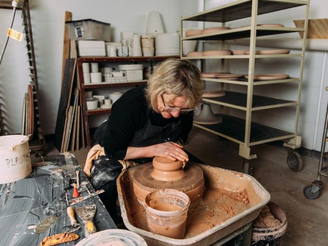 molding a pot at JamFactory, Adelaide