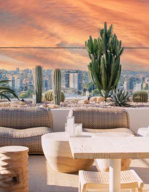 a vibrant, pastel sky at Sunsets Rooftop, Brisbane