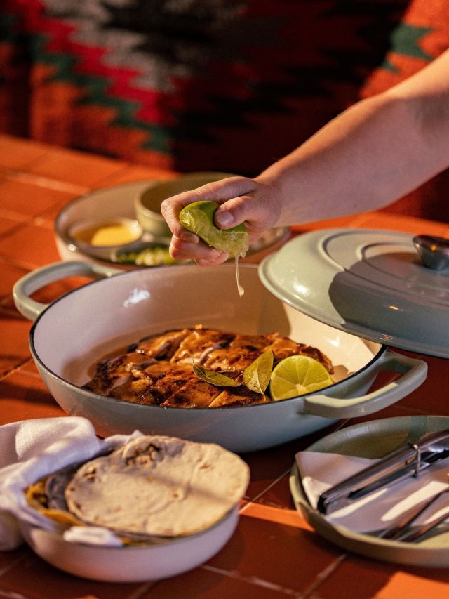 squeezing lemon into a dish at Playa Mexican, Sunshine Coast