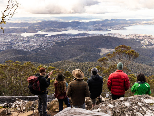 a group of hikers admiring the scenery from kunanyi 