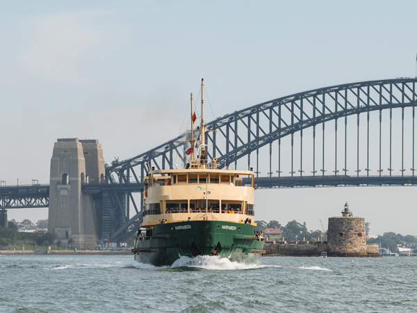 a ferry passing through Sydney Harbour