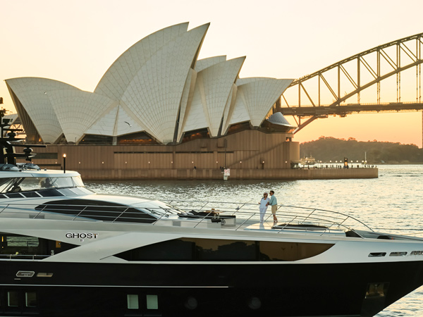 a yacht cruising past Sydney Harbour