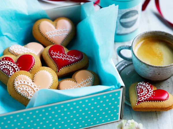 a box of sweet treats with a cup of coffee at Adri’s Gingerbread in Lisarow