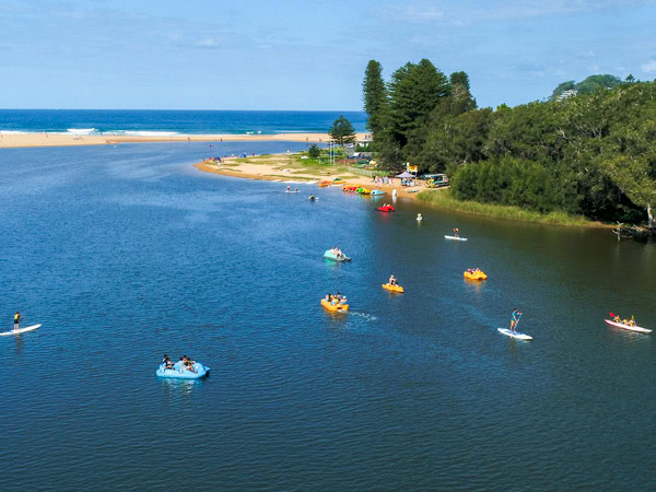 an aerial view of paddlers at Central Coast with Aquafun on Avoca Lake