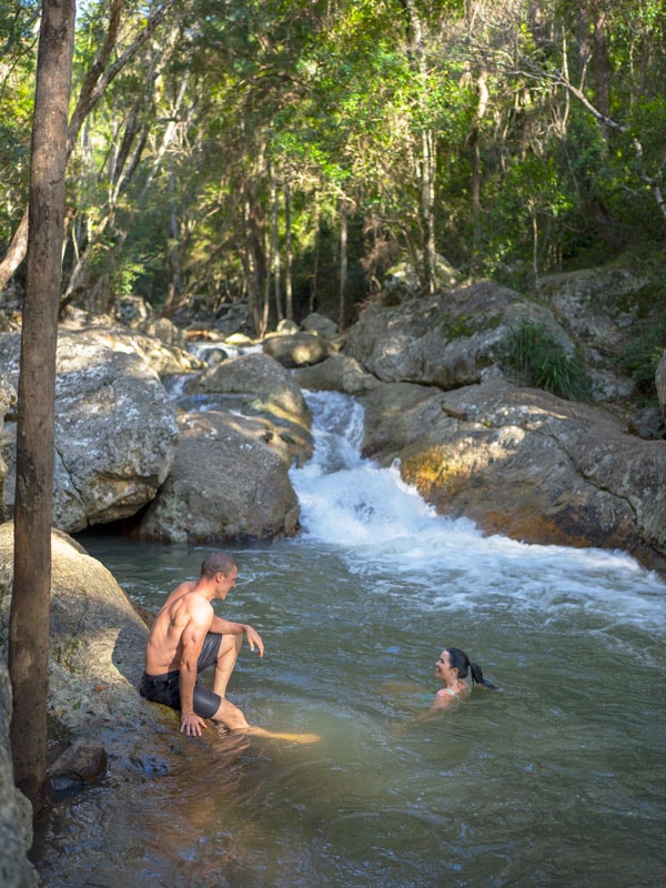 two people swimming in Cedar Creek, Brisbane