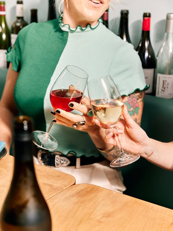 clinking glasses of wine at Good Gilbert bar in Adelaide