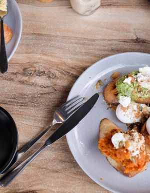 a plate of food with coffee at Bank Street + Co, Port Fairy