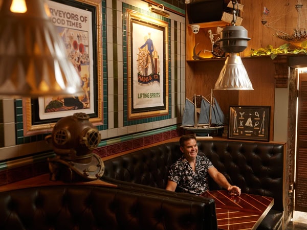 a man sitting in the corner at Hains & Co, Adelaide
