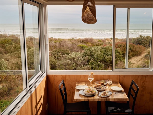 a dining setup at Kuti Shack overlooking Goolwa Beach