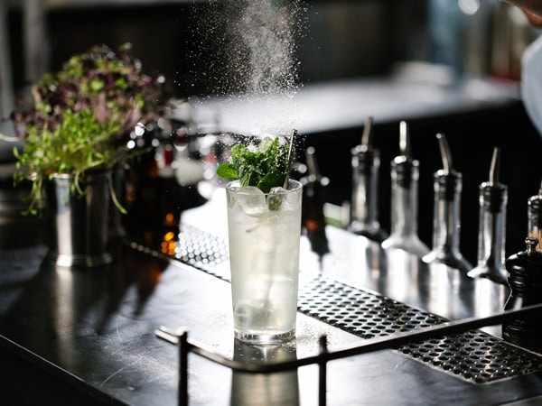 spicing up a drink at Maybe Mae bar in Adelaide
