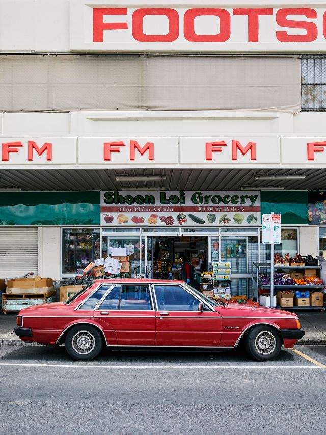 a red vintage car outside Footscray Market, Melbourne suburbs