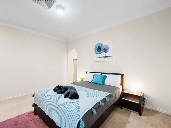 the bedroom at this two-story Royal waterfront in Perth