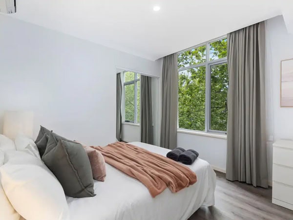 a bed facing a window at Royal Respite, Perth