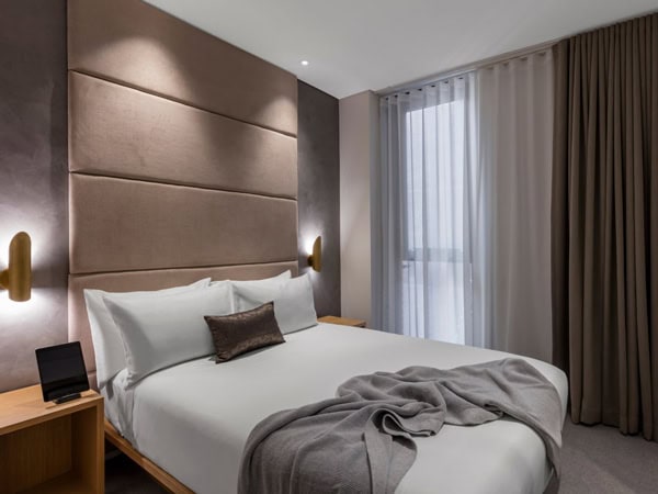 the bed at SKYE Suites in Sydney