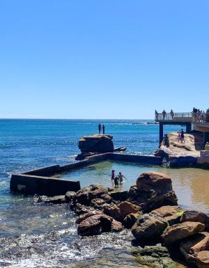 Families swimming in the rock pool at Terrigal Beach on the Central Coast