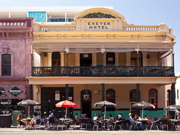 outdoor dining under huge umbrellas at The Exeter Hotel, Adelaide