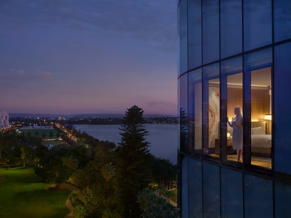a woman looking out the window at Ritz Carlton Perth