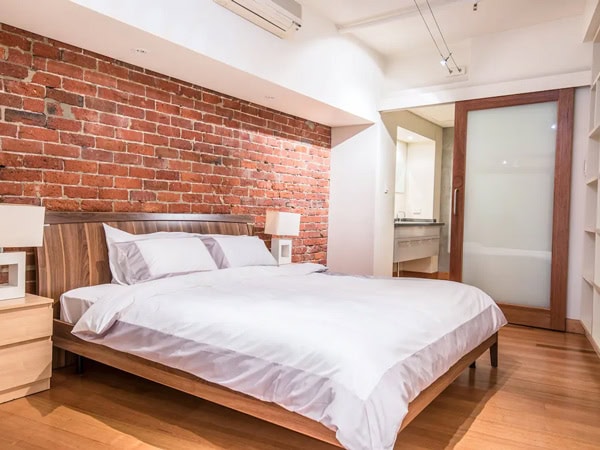 a rustic bedroom at an upscale & polished loft in Perth
