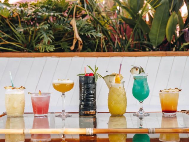 colourful cocktails lined up on the table at Mumbo Jumbo’s, Terrigal